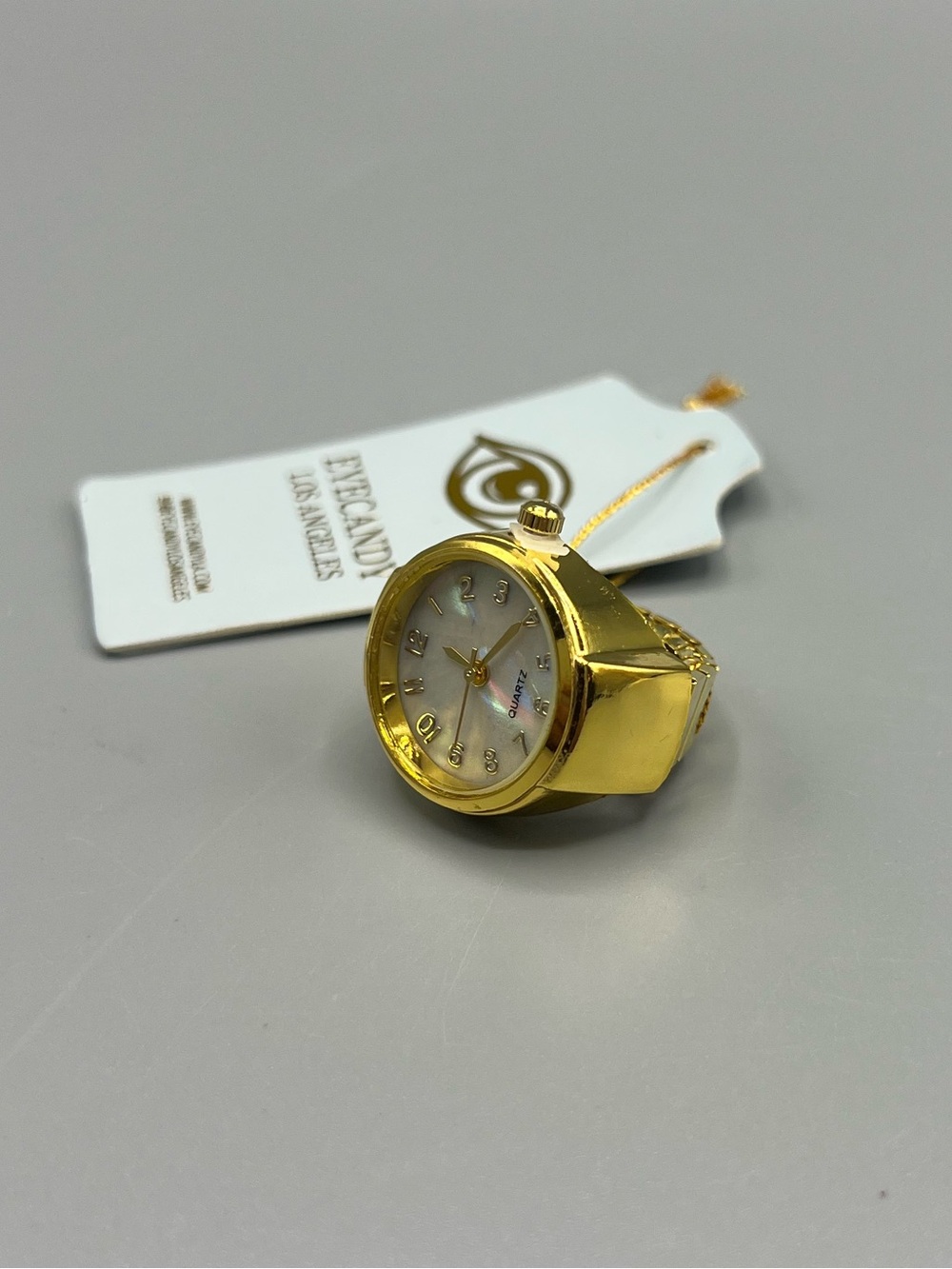 Eye Candy Gold Tone Ring Watch with Mother of Pearl Dial